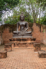 Buddha images are located outdoors. In the park in Ratchaburi province of Thailand