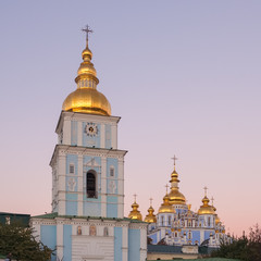 Fototapeta na wymiar St. Michaels Golden-Domed Monastery with cathedral and bell tower during twilight in Kiev, Ukraine