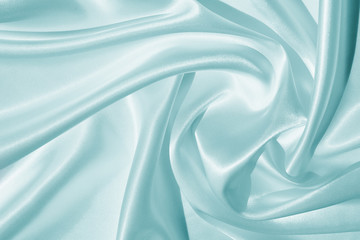 The texture of the satin fabric of blue color for the background 