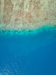 Aerial image from a drone of blue lagoon at Bora Bora island, Tahiti, French Polynesia, South...