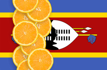 Swaziland flag and citrus fruit slices vertical row