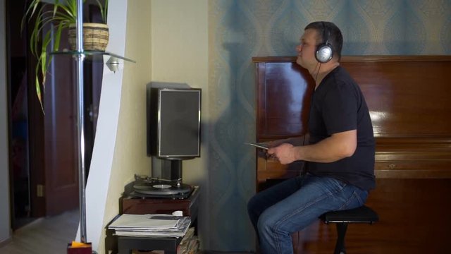 Man Listening To Music on the Vynyl Turntable
