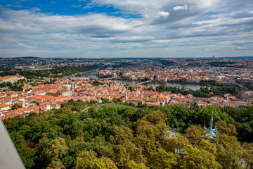 Fototapeta na wymiar Prague Lesser Town cityscape skyline high angle view as seen as descending from the magnificent Petrin observation and lookout tower across Vltava river in the Czech Republic capital city