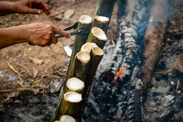 make glutinous rice with coconut milk roasted in a length bamboo joints cylinder, Khao Lam is Traditional Thai sweet dessert