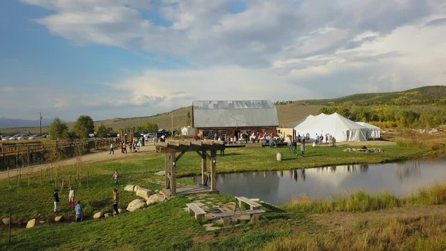 Drone flies low around party at Strawberry Creek Ranch in Granby Colorado.