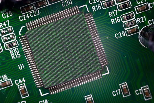 Close-up of Electronic Computer processor in a computer circuit board. Two photographers binary coding one zero and computer motherboard merged together. Binary coding one zero consists of 7 layers.