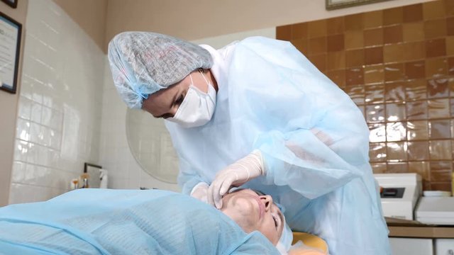Beauty surgical procedure. Face skin lifting with cog threads to eliminate signs of aging. Face contour. flaccid skin lifting. 4k