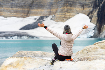 Hiker enjoying glacier lake in Glacier National Park