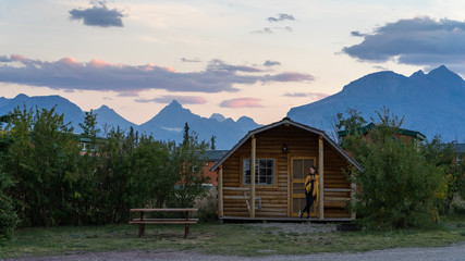 Girl enjoying sunset at the cabin in Glacier National Park