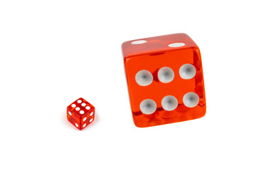 Two red glass dices isolated on white. Six and flying in the air, view from above.