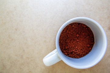 An unmade cup of instant coffee
