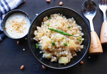 Indian dish made out of Sago called Sabudana khichdi, Usually eaten during fasting days, served with curd in a bowl