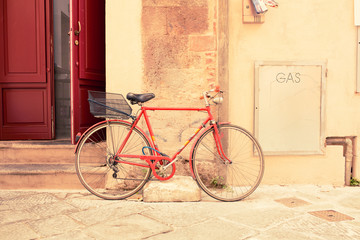 Fototapeta na wymiar Italian retro bike parked in the old streets of Siena, Italy. 