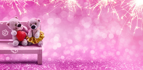 Valentine's Day, concept. Couple sweet bears with heart on rose light bokeh background.
