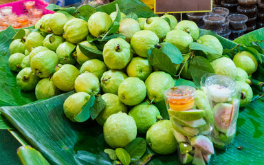 Pink guava is edible and rich in vitamin C, A, E, calcium and fiber. Delicious cut fruit in plastic bag with tasty dips is good sell at street stall and every market in Bangkok, Thailand, Asia.