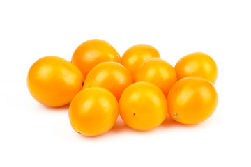 Fresh yellow Cherry tomato or sun gold (Solanum lycopersicum var. cerasiforme) isolated on white background