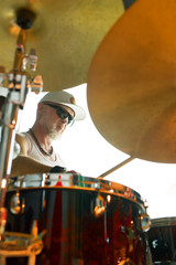 Obraz premium Drummer plays musical percussion instrument with drumsticks