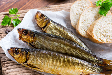 Delicious smoked salmon herring beautifully garnished on a rustic wooden table