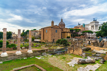 Ruins of Roman Forum. Curia Julia, Roman columns and church of Santi Luca e Martina. Rome. Italy