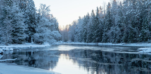 Sunrise river in winter. Farnebofjarden national park in Sweden.