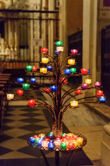 Prayer candles at church of the Santissima Trinita dei Monti. Rome. Italy
