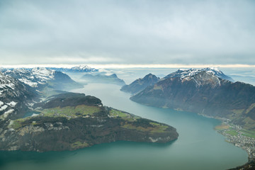 Fototapeta na wymiar Beautiful views on Lake Lucerne and Alps as seen from top of Fronalpstock peak