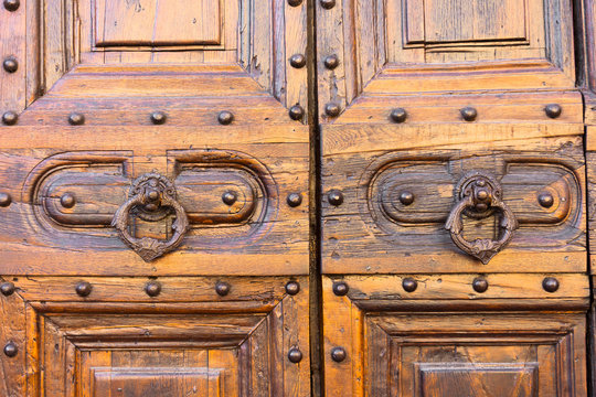 Antique door handle with a nice old wooden door detail