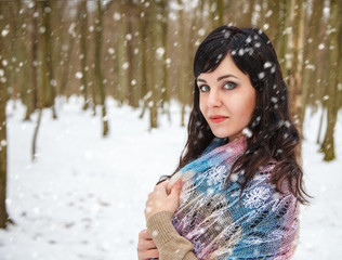 young woman on a walk in the winter park