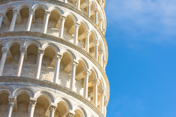The Leaning Tower of Pisa, Italy, detailed view from close up, arches and columns.