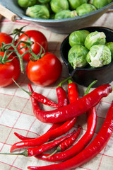 red chili peppers with Brussel sprouts and tomatoes