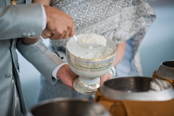 hot rice, give alms to a Buddhist monk
