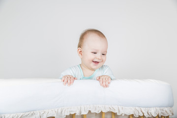 A one year boy in a crib