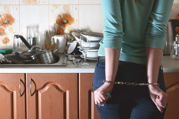 Fragment of the handcuffed female body at the kitchen counter, f