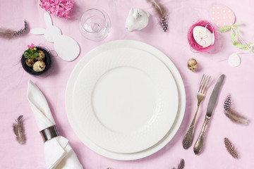 Easter romantic dinner. Elegance table setting spring pink flowers on pink linen tablecloth. Top view. - Powered by Adobe