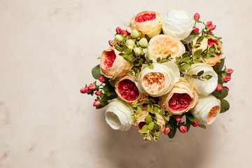 Fototapeta na wymiar Top view of wedding bouquet on the pink marble table