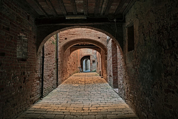 Buonconvento, Siena, Tuscany, Italy : the covered street Via Oscura in the old town