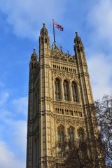 Fototapeta na wymiar Victoria Tower with the flag of Great Britain. City of Westminster, Houses of Parliament. London, United Kingdom.