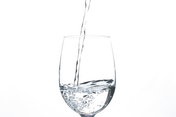 A glass of water on a white background. Close-up