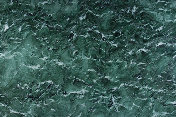 Texture of natural green stone with white pattern Verde Venezia