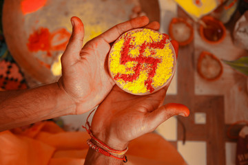 Close up of lightening lamps or diyas or divas isolated on white of brown color with a swastik or Swastika drawn in it