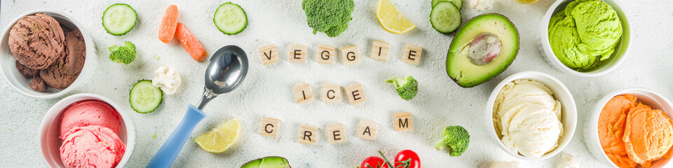 Trendy vegan food, summer healthy dessert concept, colorful diet vegetable ice cream with avocado, cucumber, tomato, beet, carrot, broccoli, cauliflower. Frozen veggie smoothie,  banner