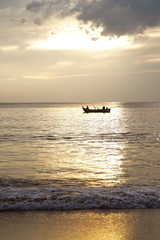 Fototapeta na wymiar Silhouette Fishing Boat Before Sunset 