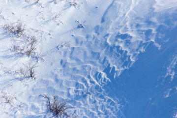 White snow on the mountainside as a background