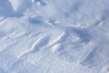 White snow on the mountainside as a background