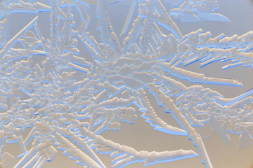 Snow patterns on glass as an abstract background
