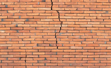 Old red brick wall cracked