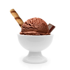 Chocolate ice cream scoop in bowl with wafer stick and chocolate bar isolated on white background