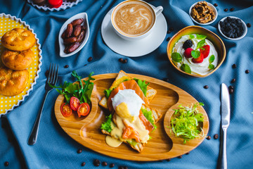 poached egg, breakfast with coffee and scrambled eggs and toast in a pan