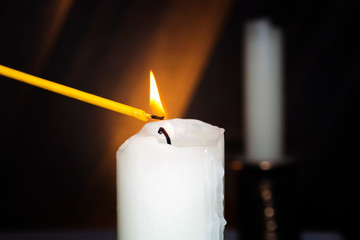 lighting candles in a church