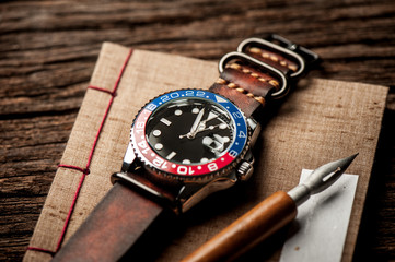 men wristwatch with leather strap